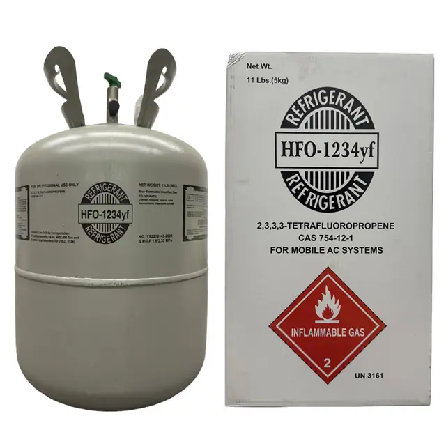 Five upright 11 lb refrigerant cylinders standing together as a single group.