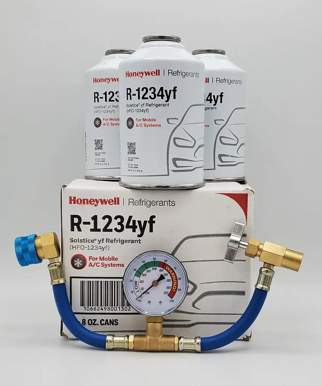 Three 8 oz cans of Honeywell R-1234yf refrigerant with brass can tap